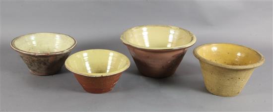 Four 19th century terracotta cream pans, with glazed interiors